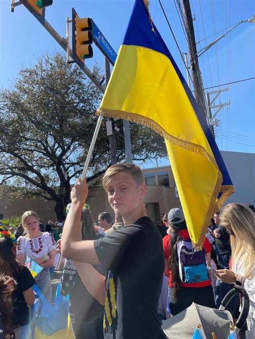 Stepon holding a Ukrainian flag